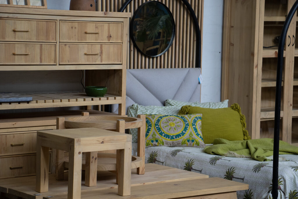 Cape Town showroom image that features wooden sideboards and coffee tables
